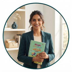 A professional portrait of Meera Joshi holding a VENRO Magic Practice CopyBook in a modern, sunlit home office setting.