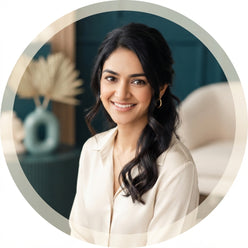 A professional portrait of Sneha Reddy, a South Asian influencer, smiling in a clean studio setting.